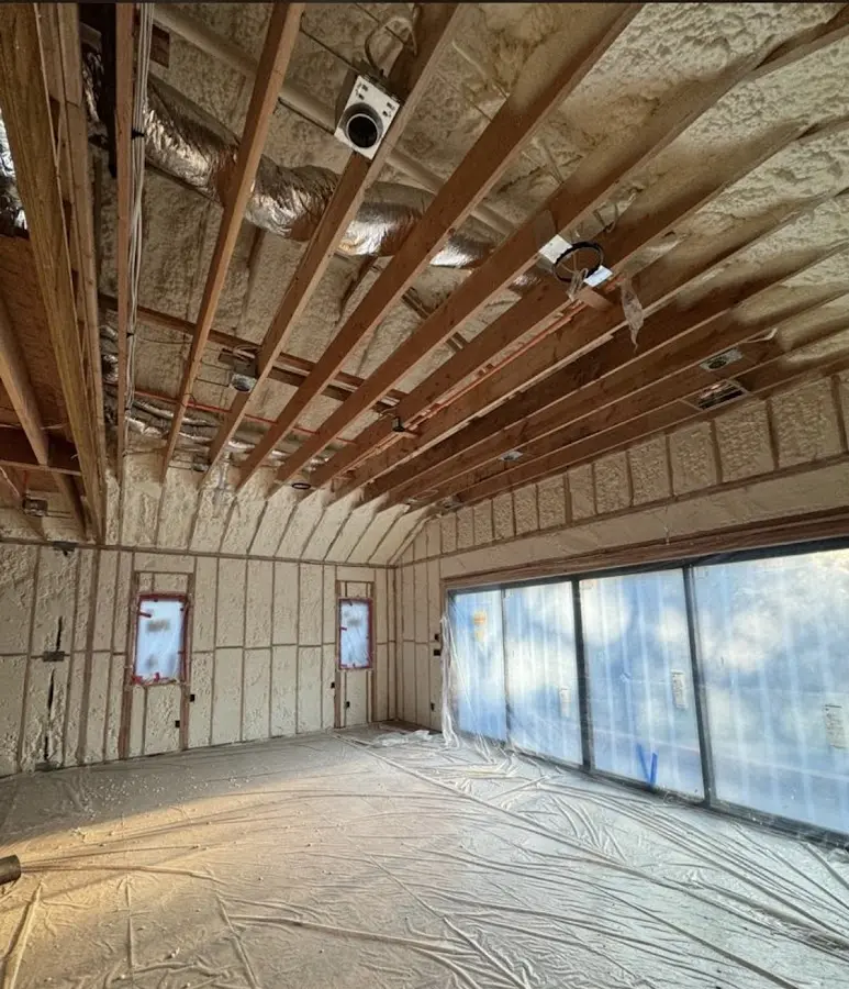 Interior walls and ceiling insulated with spray foam during new construction in Grayling
